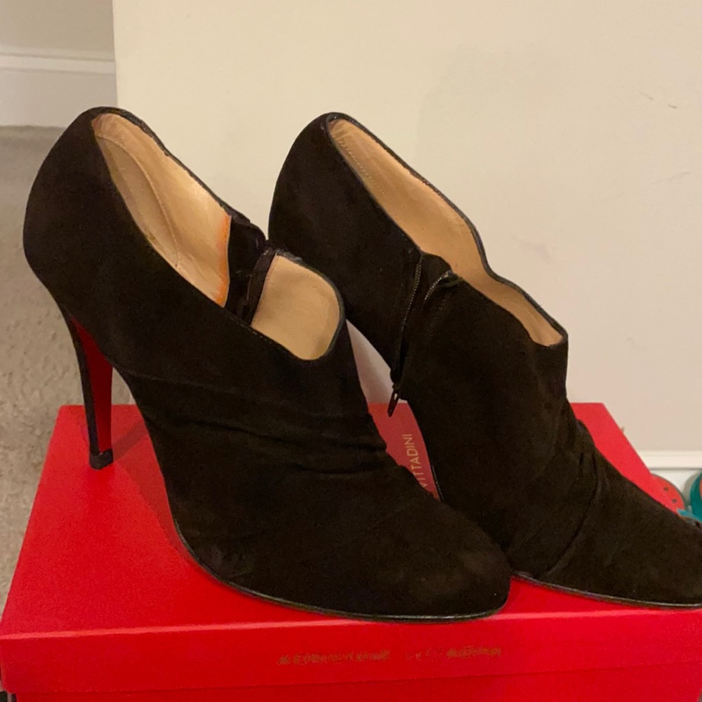 Christian Louboutin‘s Brown booties